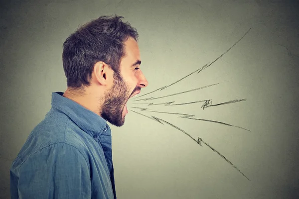 Side profile portrait of young angry man screaming — Stock Photo, Image