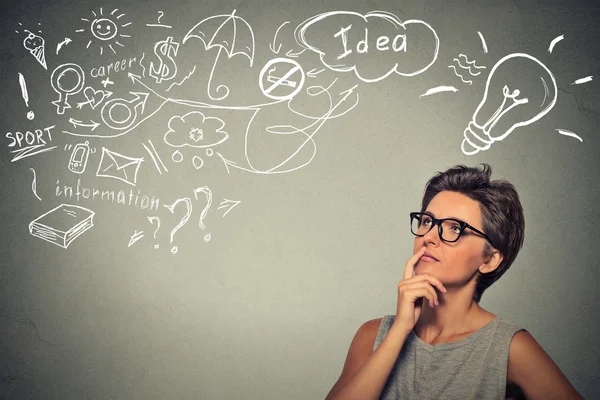 Woman thinking dreaming has many ideas looking up — Stock Photo, Image