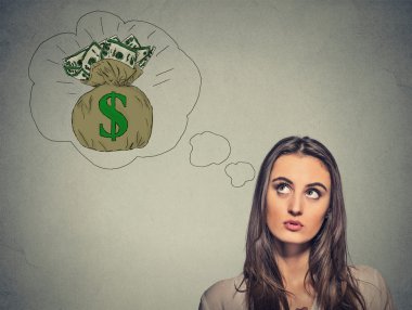 Woman dreaming of financial success a lot of money 