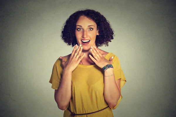 Happy woman looking excited, surprised in full disbelief, hands on chest, it 's me ? — стоковое фото