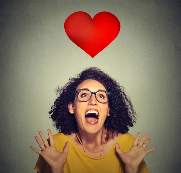 Portrait super excited funky girl in love looking up at red heart — Stock Photo, Image