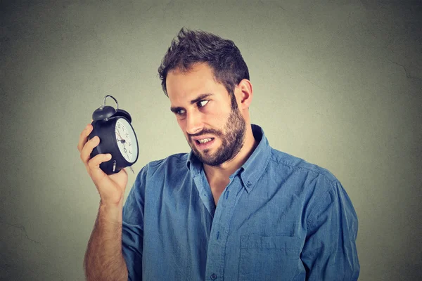Stressed annoyed man with alarm clock. It is too early for that meeting — Stock Photo, Image