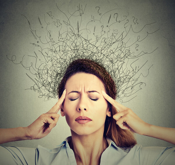 woman with worried stressed face expression eyes closed trying to concentrate 