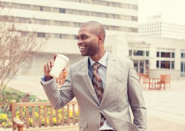 portrait businessman with coffee going to work