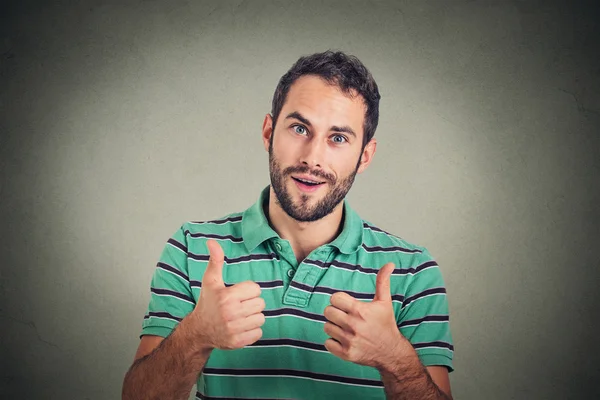 Happy man giving thumbs up sign. Positive human face expression body language — ストック写真