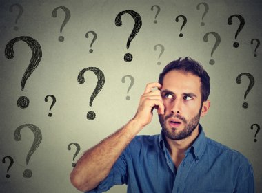 Thoughtful confused handsome man has too many questions and no answer  clipart