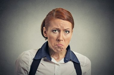 Closeup portrait young serious angry grumpy woman 