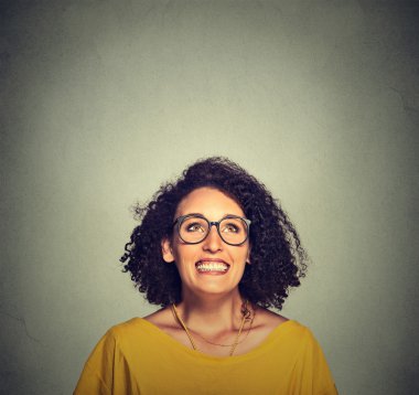 super excited happy funky girl in glasses looking up 