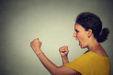 Side profile angry screaming woman
