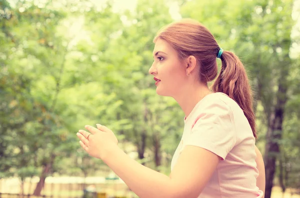 Side profile running young woman. Female runner jogging during outdoor workout — Zdjęcie stockowe