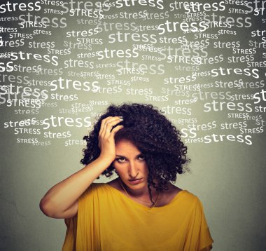 Stressed middle aged woman isolated on gray wall background  