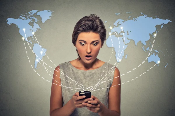 Shocked woman holding using smartphone connected browsing internet worldwide — Stok fotoğraf