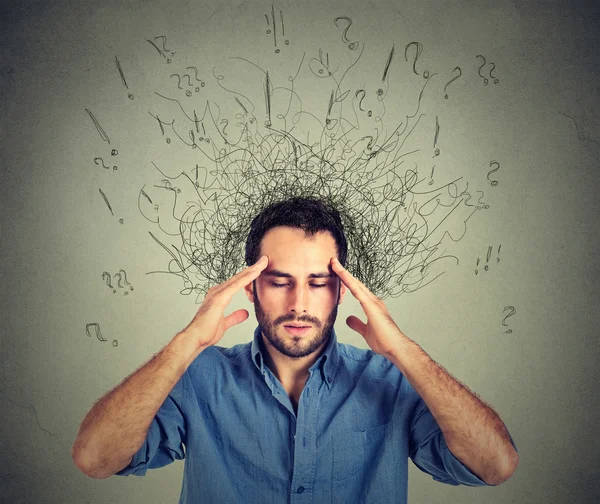 Sad young man with worried stressed face expression and brain melting into lines — Stock Photo, Image