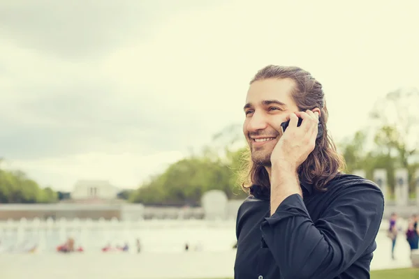 Closeup portrait happy young man talking on mobile phone — Stok fotoğraf