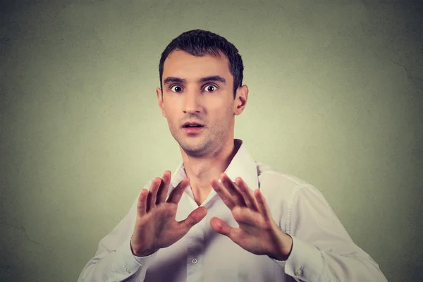 Man looking shocked scared trying to protect himself from unpleasant situation — Stock Photo, Image