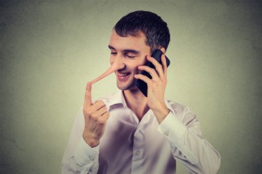 Liar customer service representative. Happy man with long nose talking on mobile phone