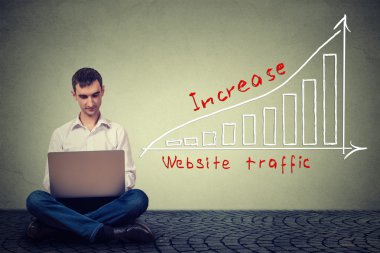 man using laptop working on a plan to increase website traffic. Technology marketing concept 