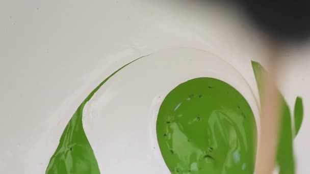 Mixing Two Colours Paint White Green Slowly Stirring Spirals Adding — Stock Video