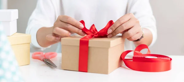 Closeup Hand Making Present Gift Box Red Ribbon Christmas Birthday Stock Image
