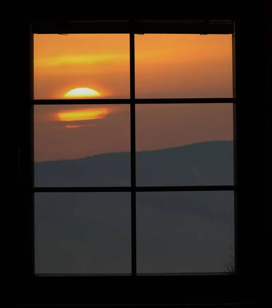 sunset behind the window