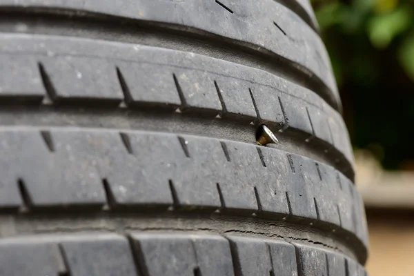 A screw in the tire — Stock Photo, Image