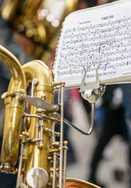 Saxophone and musical score — Stock Photo, Image