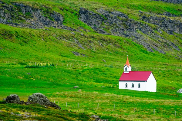 Secluded church near the Vatnsfjordur fjord — Stock Photo, Image