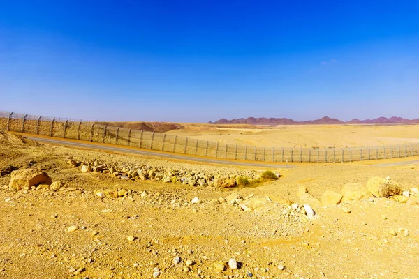 View of desert landscape and the Israel - Egypt border. Eilat Mountains, southern Israel