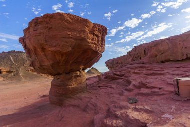 View of landscape and the Mushroom rock formation, in the Timna Valley, Arava desert, southern Israel clipart