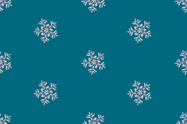 Winter seamless pattern. Snowflakes on a blue background.