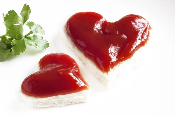 Bread and ketchup in shape of heart — Stock Photo, Image