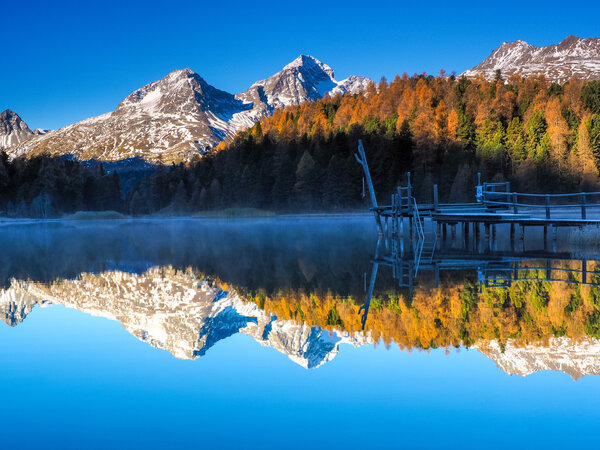 reflections on lake Lej da Staz