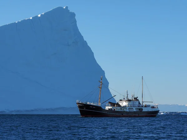 Ship in front of Iceberg Stock Picture