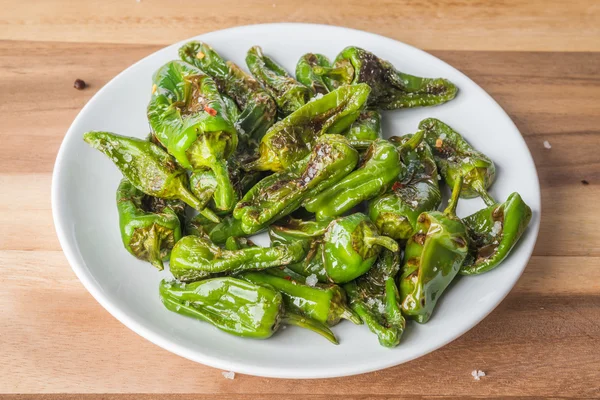 Roasted padron peppers on a plate — Stock Photo, Image