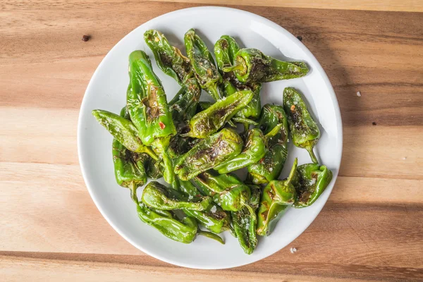 Roasted padron peppers on a plate — Stock Photo, Image