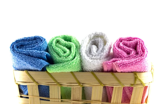 Colorful towels in rolls on a white background — Stock Photo, Image