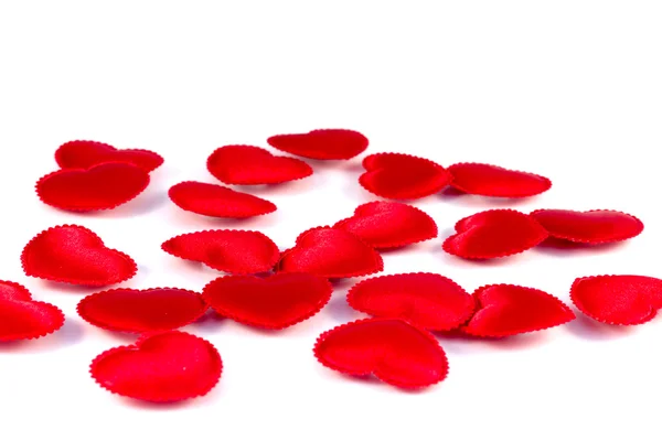 Several small red hearts tissue on a white background — Stock Photo, Image