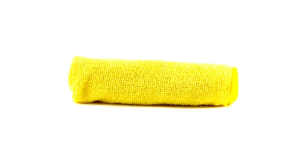 Yellow towel rolled up on a white background — Stock Photo, Image