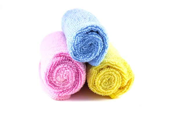 Red yellow and blue towel rolled up on a white background — Stock Photo, Image