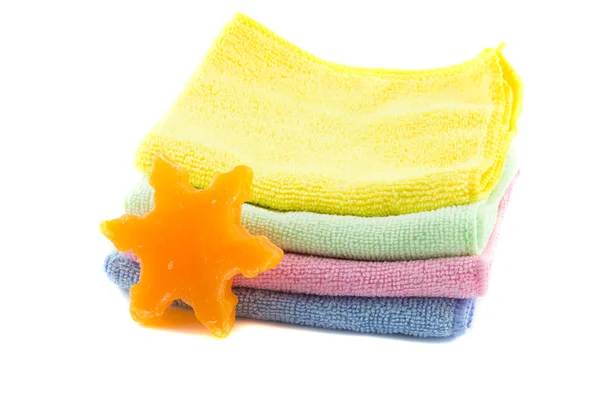 A stack of colorful towels and soap in the shape of a star-shape — Stock Photo, Image