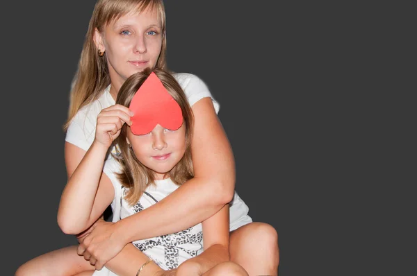 Mother and daughter shows heart — Stock Photo, Image