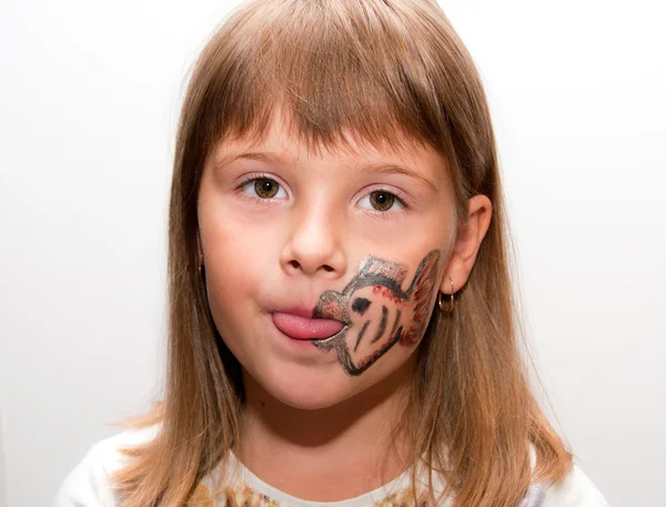 Dívka s namalovaným obličejem — Stock fotografie