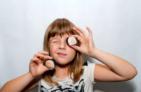 Girl and sushi — Stock Photo, Image