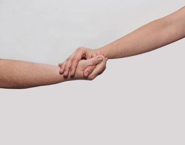 Twee handen oude vrouw en jonge vrouw — Stockfoto