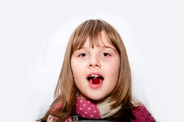 Ill Teen girl with scarf takes red pill — Stock Photo, Image