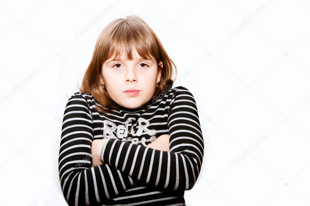 Unhappy teen girl with crossed hands