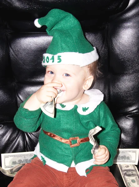Cute little baby boy and dollars — Stock Photo, Image