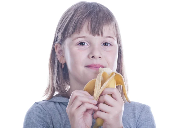 Girl eats banana — Stock Photo, Image