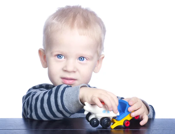 Beautiful little boy with blond hair and blue eyes — Stock Photo, Image