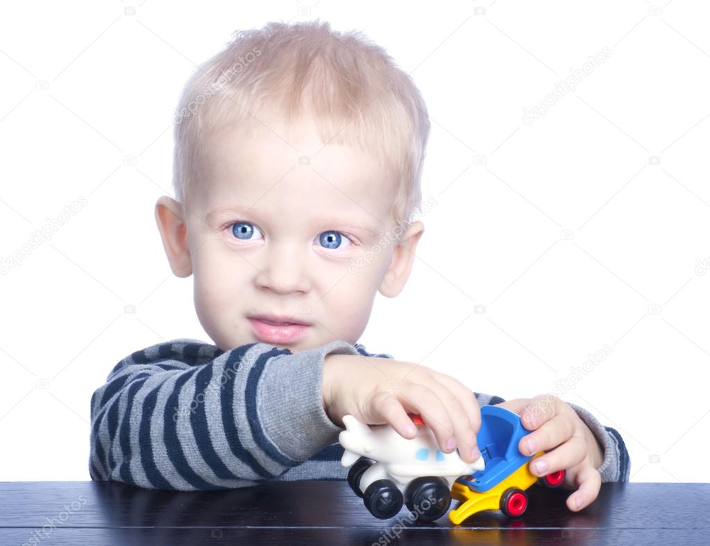 Beautiful Little Boy With Blond Hair And Blue Eyes Stock Photo